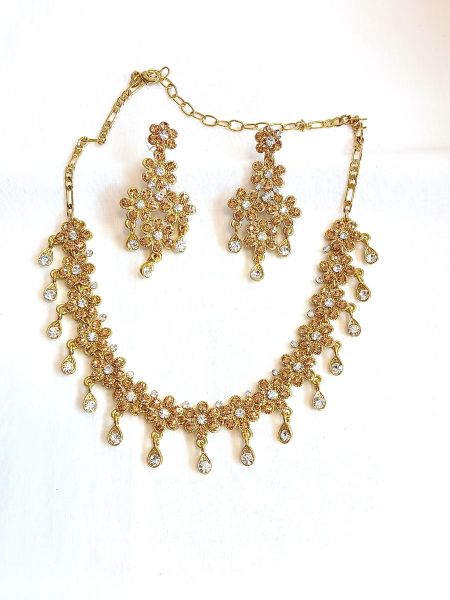 Neckalace and earring with white colour stones
