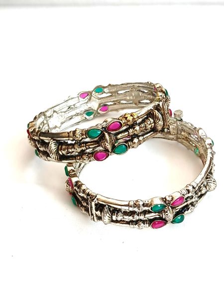 Silver colour designer bangles with green/pink stones