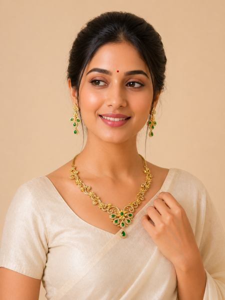 Neckalace and earring with white and green stones.