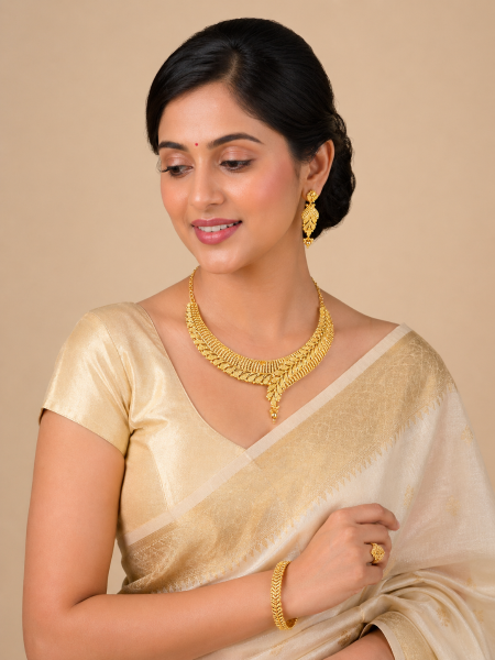 Gold plated necklace set in net + flower design