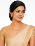 Gold plated leaf design necklace with earring