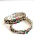 Silver colour designer bangles with green/pink stones