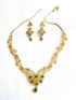 Neckalace and earring with white and green stones.