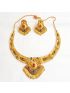 Gold plated necklace set with central pendant with red and green gemstone
