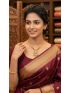 Elegant gold-tone necklace with a beautifully crafted circular pendant and textured bead accents. A timeless statement piece, perfect for weddings, festive occasions, and everyday elegance.