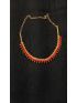 Elegant gold-tone necklace featuring vibrant red bead accents. A timeless statement piece, perfect for weddings, festive occasions, and party wear