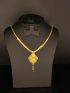 Elegant gold-tone necklace featuring a beautifully detailed filigree pendant with a graceful drop charm for a timeless finish