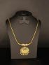Elegant gold-tone necklace featuring a dazzling butterfly-inspired pendant adorned with sparkling stones and delicate hanging accents.