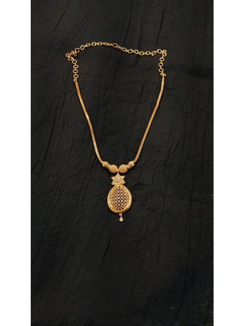 Elegant gold-tone necklace featuring a delicate floral pendant with intricate detailing. Perfect for adding timeless elegance to both everyday wear and special occasions.