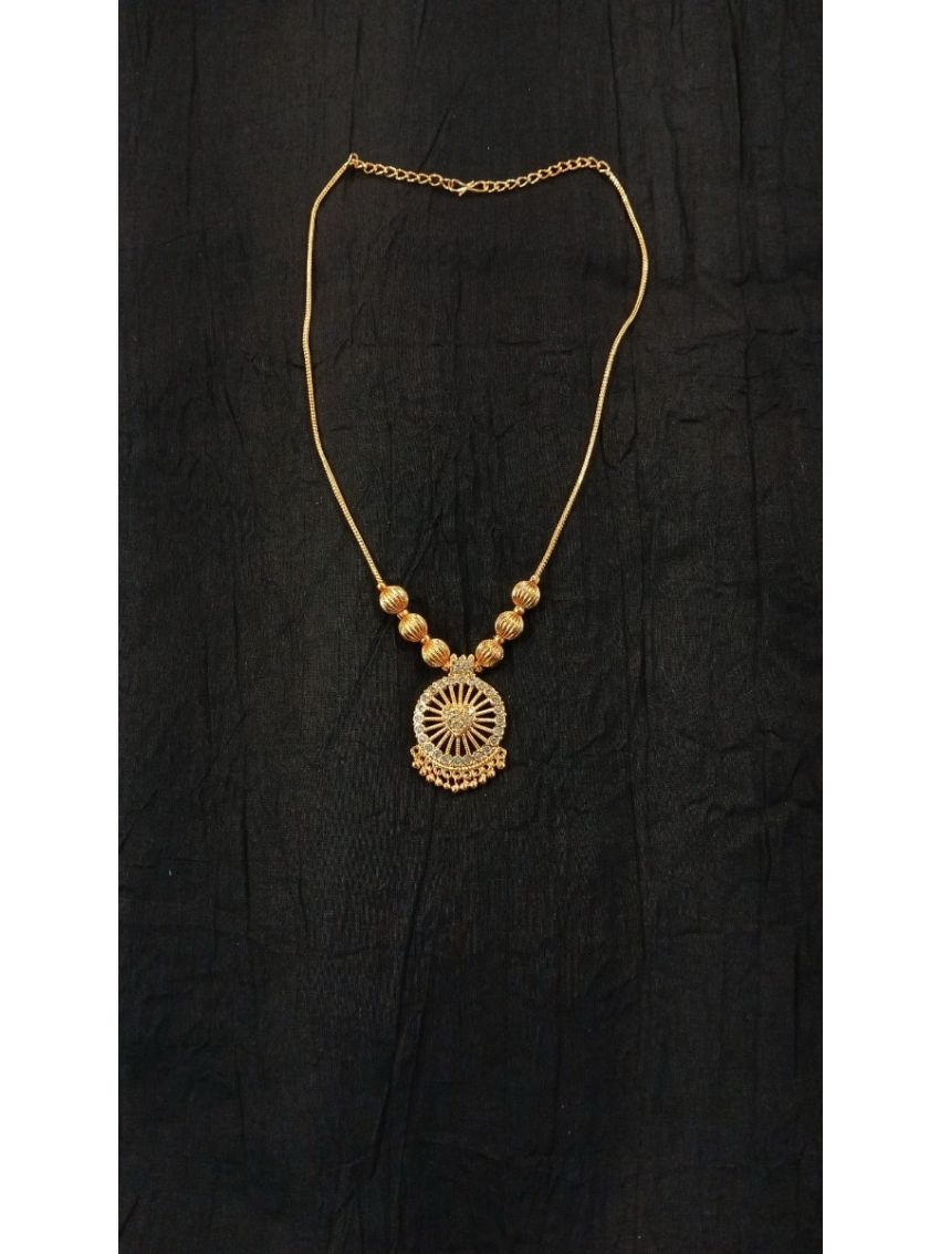 Elegant gold-tone necklace with a beautifully crafted circular pendant and textured bead accents. A timeless statement piece, perfect for weddings, festive occasions, and everyday elegance.